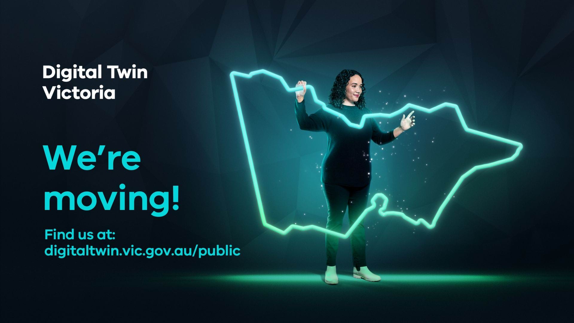 A woman holds up a glowing outline of the State of Victoria. Text on the left hand side reads 'Digital Twin Victoria: We're moving. Find us at digitaltwin.vic.gov.au/public'.